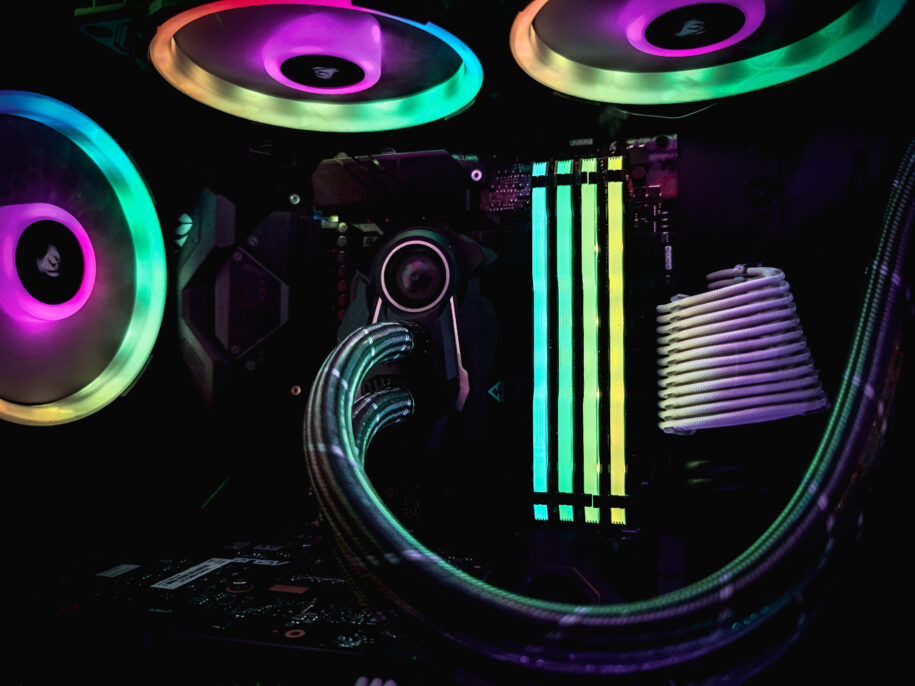 gaming pc desktop interior, RGB RAM lights next to liquid cooler